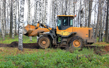 Fototapeta na wymiar the bulldozer leveled the ground
