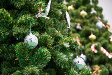 Christmas grass ball on tree with beautiful ornament