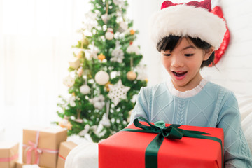 little cute Asian girl opens her mouth feel shocked