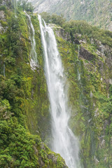 Fototapeta na wymiar fresh high waterfall with green moss