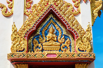 Fototapeta na wymiar close up windows bass-relief in Beautiful temple Wat Samai Kongka on Ko Pha Ngan, Thailand.