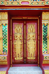 Fototapeta na wymiar close up doors bass-relief in Beautiful temple Wat Samai Kongka on Ko Pha Ngan, Thailand.