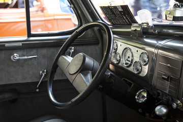Isolated Interior View of Iconic Restored 50s Vintage Automobile Dashboard and Steering Wheel,  and...