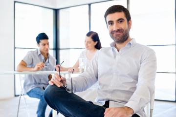 Young man in casual in office