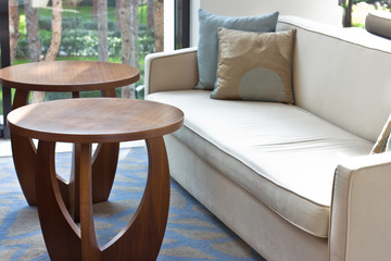 Interior. Light leather chairs and brown wooden table.