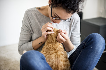 Woman petting a cat