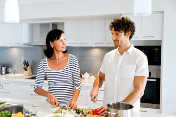 Couple cooking together at home