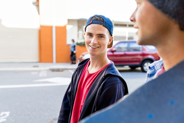 Teenager walking down the street in summer day