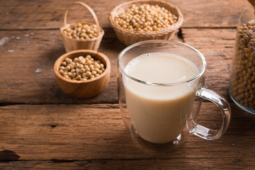 Glass with Soy Milk and Seeds on background