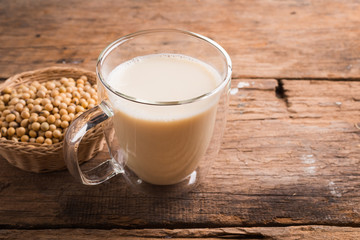 Glass with Soy Milk and Seeds on background