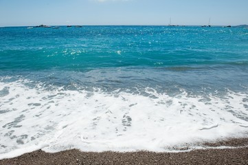 Fototapeta na wymiar Blue sea of Positano in a summer day, Amalfi coast, Italy