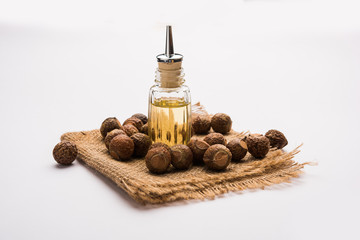 Aritha or Reetha and oil.  Soap-nuts is used as the main ingredient in soaps and shampoos also...
