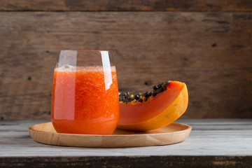 Fresh papaya smoothie juice in glass