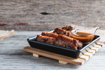 Grilled barbecue pork ribs on plate table background