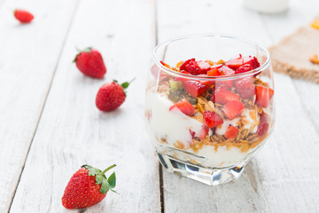 Strawberry , granola and yogurt healthy breakfast parfait
