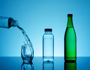 Creative splashing water in the glass