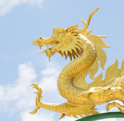 dragon statue  sky blue is the backdrop.