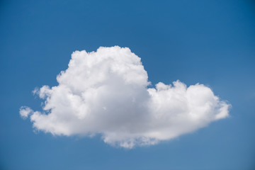 Naklejka na ściany i meble Single white cloud on blue sky and isolated
