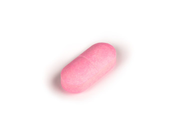 close-up of a pink pill isolated on a white backgound.psd
