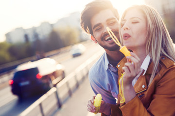 Happy couple dating and smiling while blowing bubbles