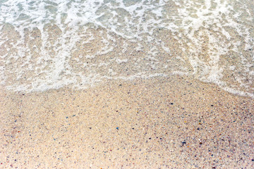 Soft Wave Of Blue Ocean On Sandy Beach