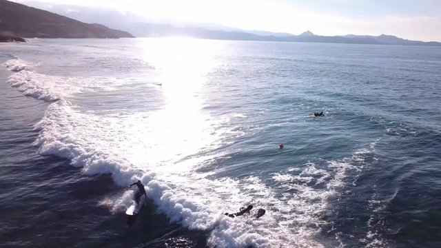 Serfers on a beach in Corsica in France