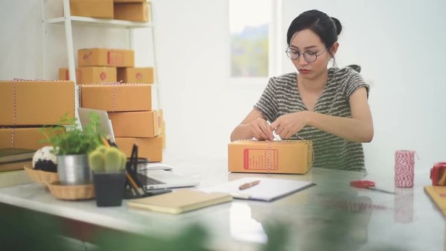 Woman Working at home with Online Business.Asian woman is working with financial documents at workplace in the office.