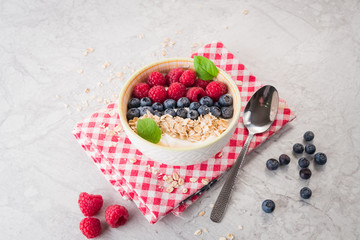 Yogurt with blueberry, raspberry and oatmeal flakes