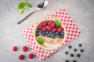 Yogurt with blueberry, raspberry and oatmeal flakes
