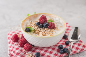 Yogurt with blueberry, raspberry and oatmeal flakes