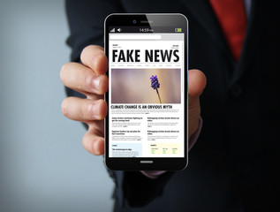 fake news businessman smartphone