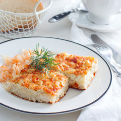 Homemade casserole with meat, vegetables and cheese in the oven.
