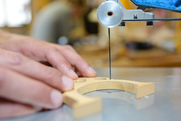 Closeup of fine blade cutting wood