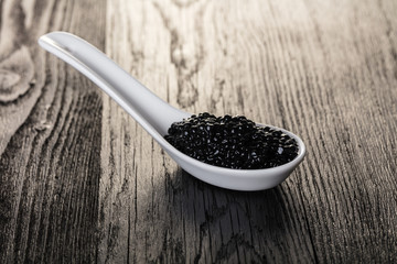 black caviar in a spoon