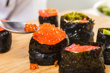Chef prepares rolls, hands closeup