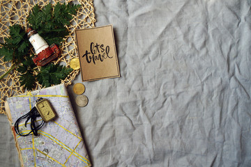 the mood of travel. card, clock and money on a gray background. Flat lay