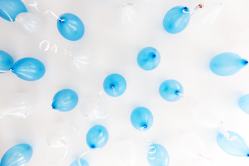 blue balloons under white ceiling