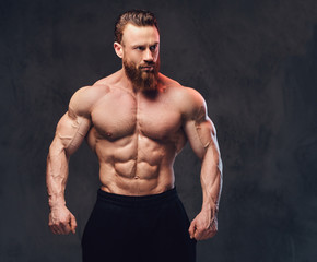 Portrait of bearded shirtless bodybuilder.