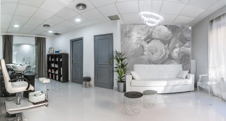 Lounge in a beauty salon with sofa and pedicure place
