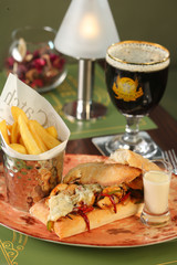 Bistro meal with sandwich, french fries, sauce, beverage