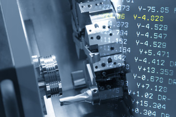 The abstract scene of CNC lathe machine (Turning machine) and NC code.Hi-precision CNC machining...