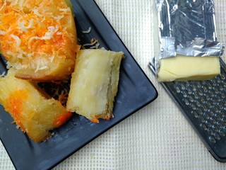 Singkong Keju, Indonesia Traditional Snack Food, made from Steamed Cassava and grated Cheese and Chili Powder for Topping