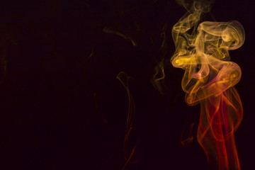 Colored smoke on black background