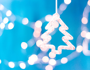 Decorated Christmas tree on blurred, sparkling and fairy background