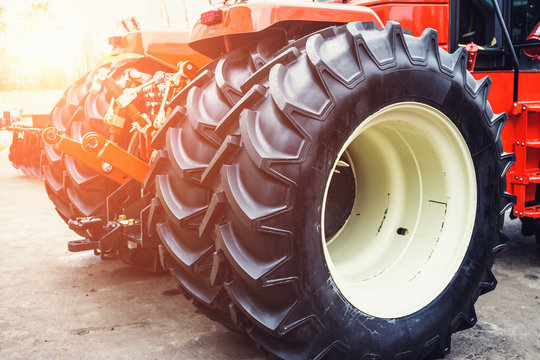 Modern Red Tractor With Big Wheels