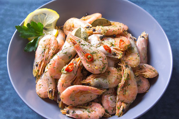 Shrimps fried with garlic and chili. Close-up, selective focus.
