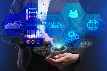 Fototapeta premium The concept of business, technology, the Internet and the network. A young entrepreneur working on a virtual screen of the future and sees the inscription: Machine learning