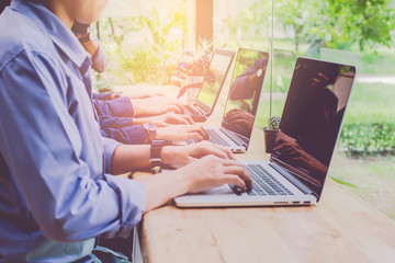 Close up. Man Working on laptop connecting networking Concept,Teamwork,With sunset,Selective Focus.