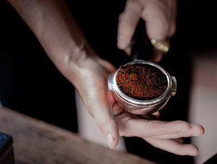 Fototapeta na wymiar Coffee powder in espresso scoop, Focused at coffee scoop