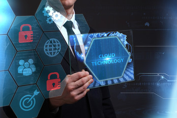 Business, Technology, Internet and network concept. Young businessman working on a virtual screen of the future and sees the inscription: Cloud technology